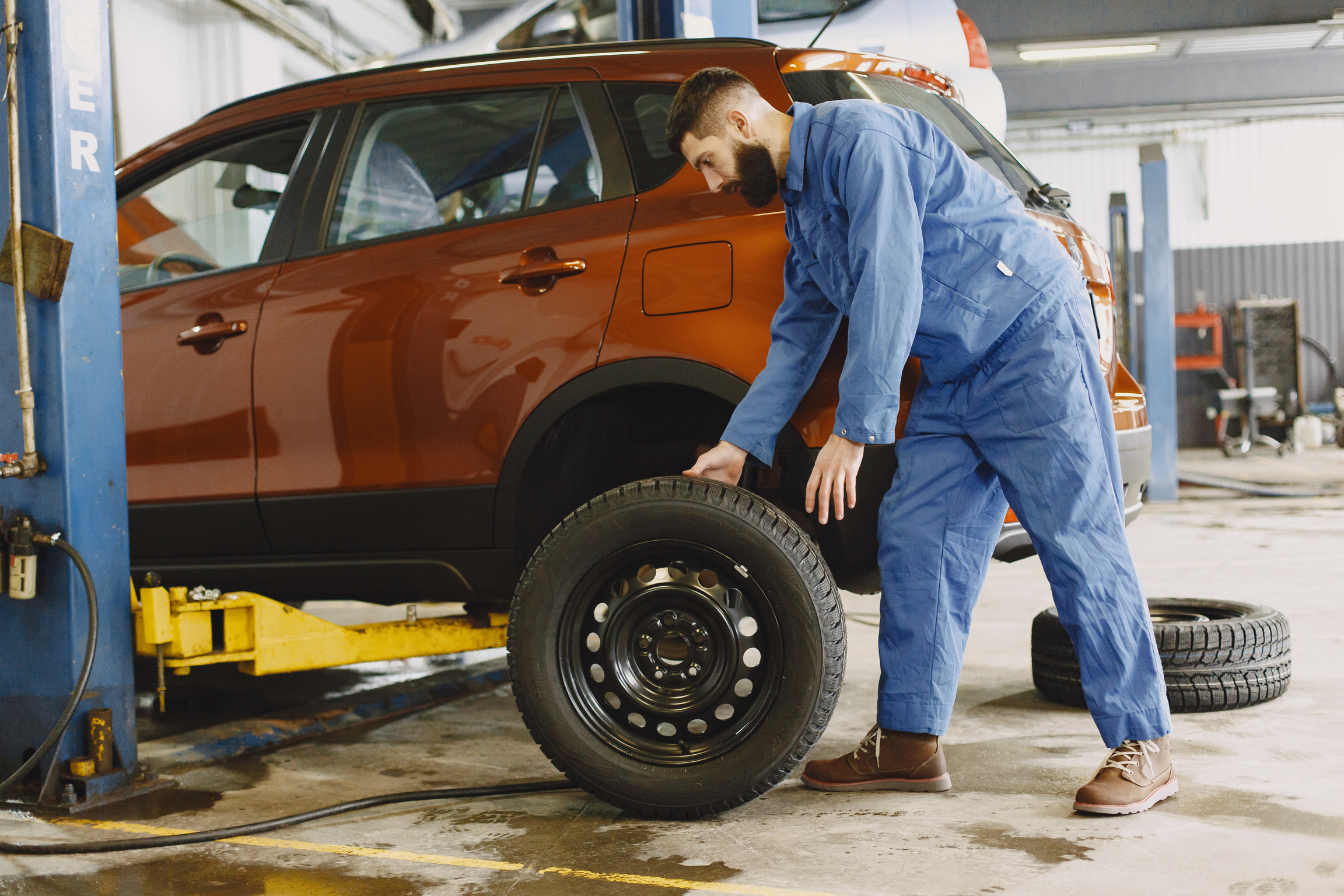 Mechanic Replacing Car Tire 