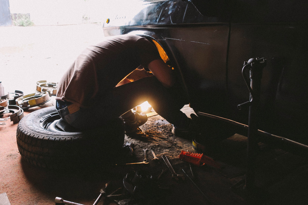 Man Repairing a Car